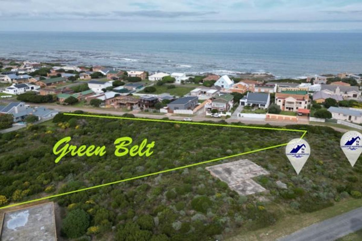 Aerial view of a vacant residential plot featuring a concrete slab foundation, situated in a coastal neighborhood with green belt access.