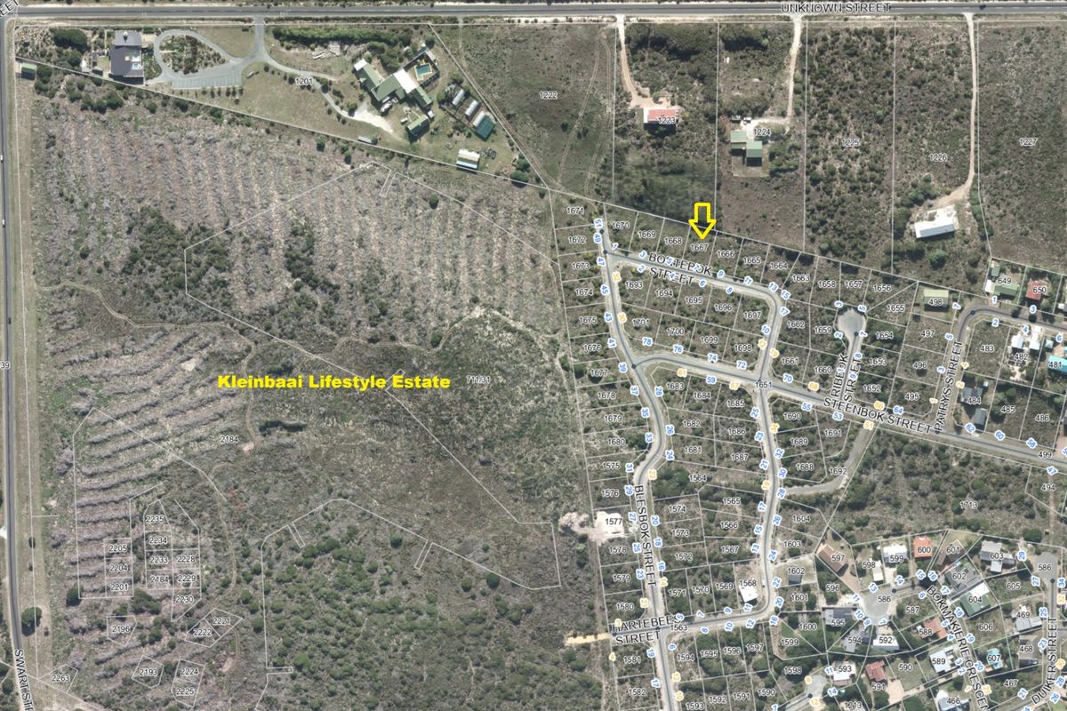 An aerial view of the Kleinbaai Lifestyle Estate showing the layout of residential plots and surrounding natural landscape.