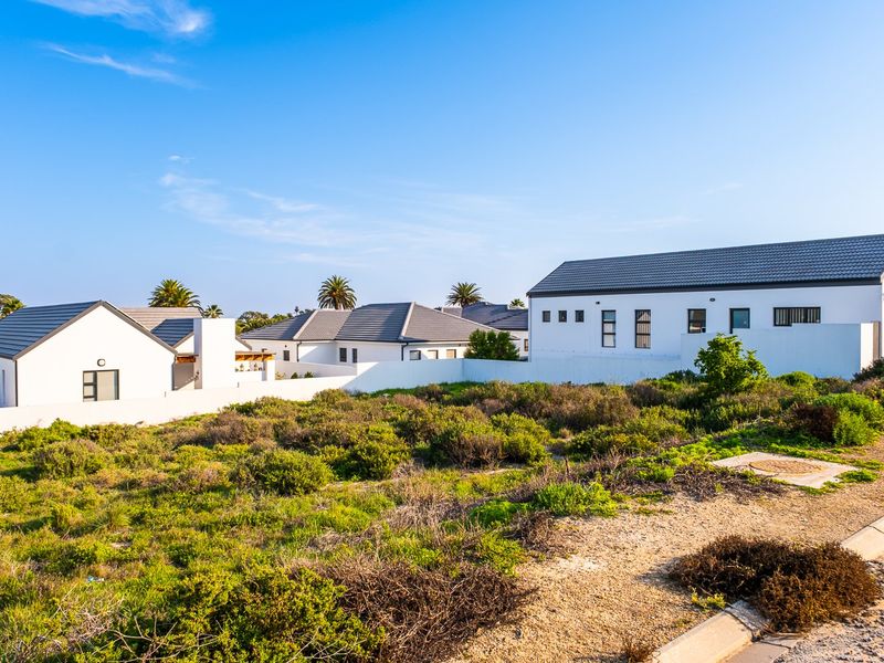 Embrace a peaceful coastal retirement surrounded by pristine fynbos, calm ocean bays, and a secure community designed for your finest chapter yet. - Photo 2
