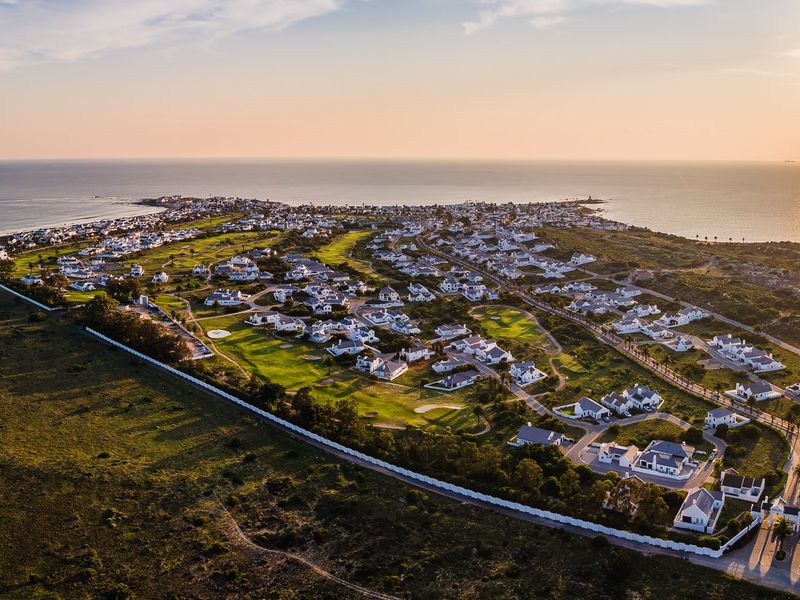 Embrace a peaceful coastal retirement surrounded by pristine fynbos, calm ocean bays, and a secure community designed for your finest chapter yet. - Photo 1
