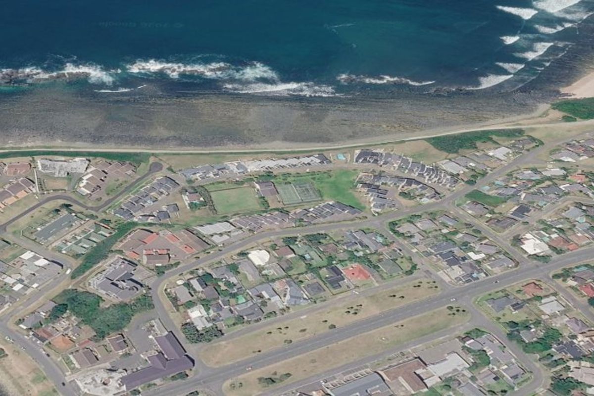 An aerial view of the coastal residential area and surrounding landscape.