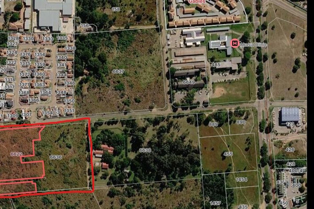 Aerial view showing the cadastral boundaries of the vacant residential land plot in relation to the surrounding neighborhood and local infrastructure.