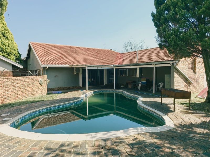 Spacious Family Living with Pool and Entertainer's Dream Backyard in Wilkoppies - Photo 1