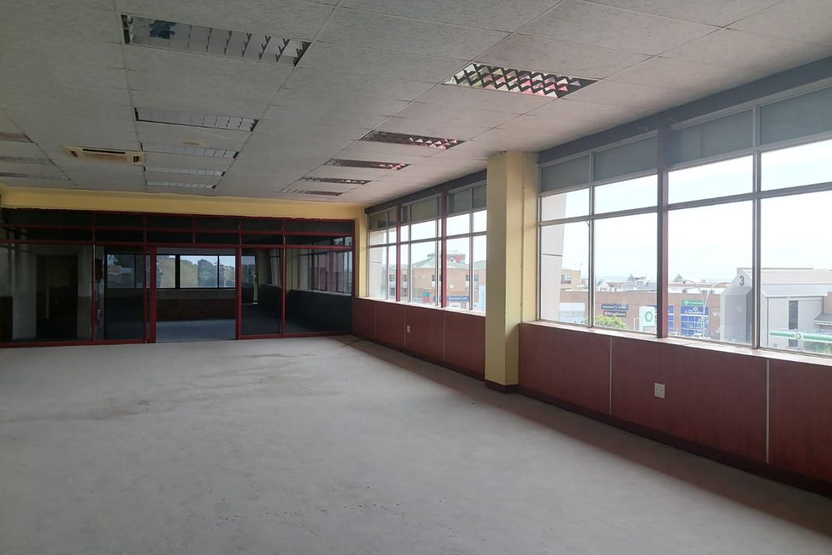 Spacious, vacant commercial office area featuring large windows with natural light, suspended ceilings, and internal glass partitioning, ready for custom fit-out.