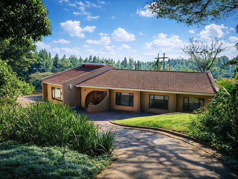 A well-maintained single-story residential house featuring a tiled roof, paved driveway, and landscaped garden surroundings.