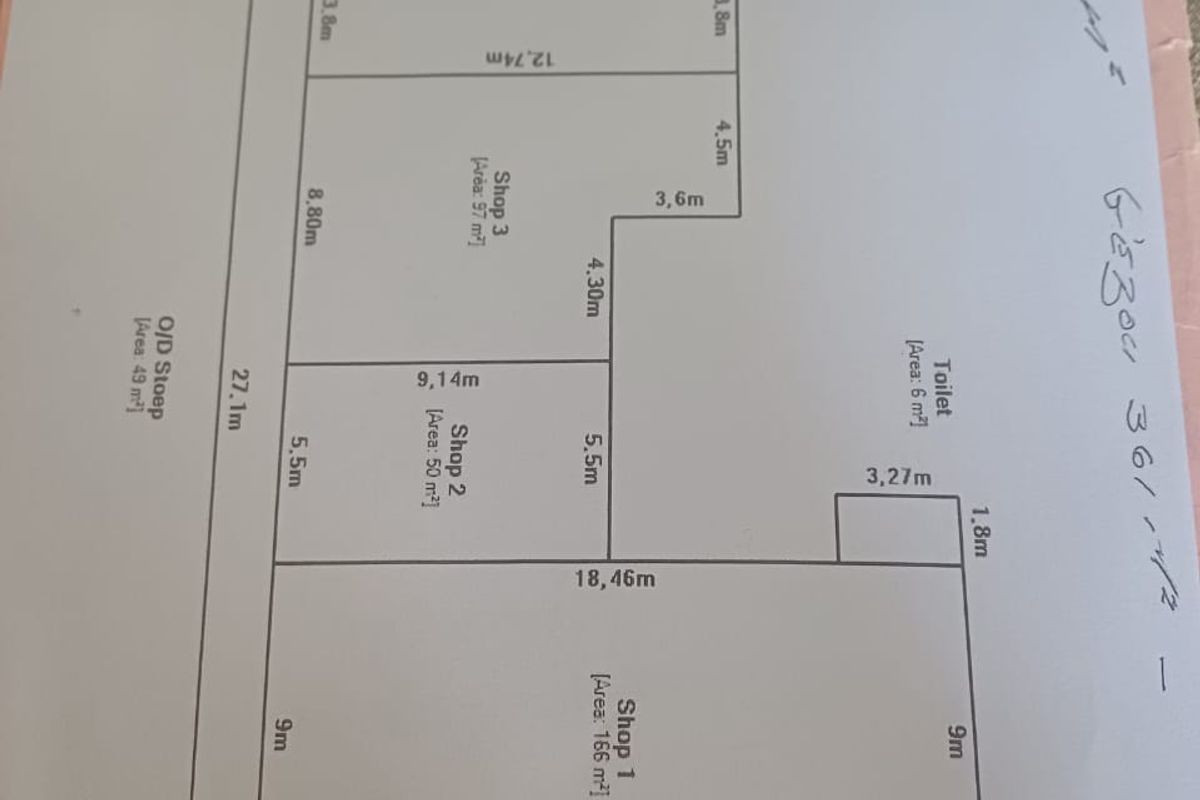 A hand-drawn floor plan layout showing the dimensions and configuration of four commercial shop units and a toilet facility.