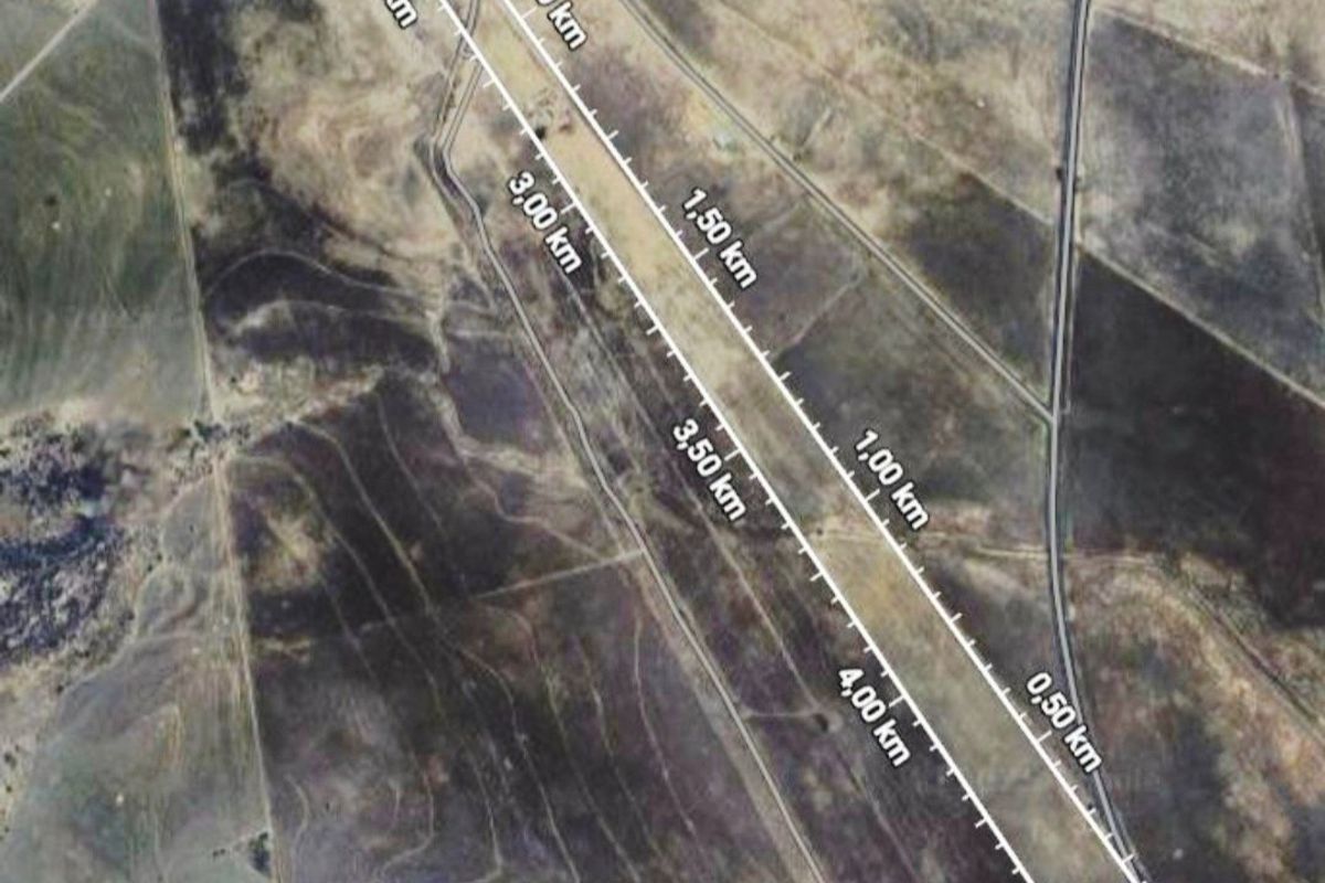 An aerial satellite view of the farm property showing land boundaries and distance measurements across the terrain.