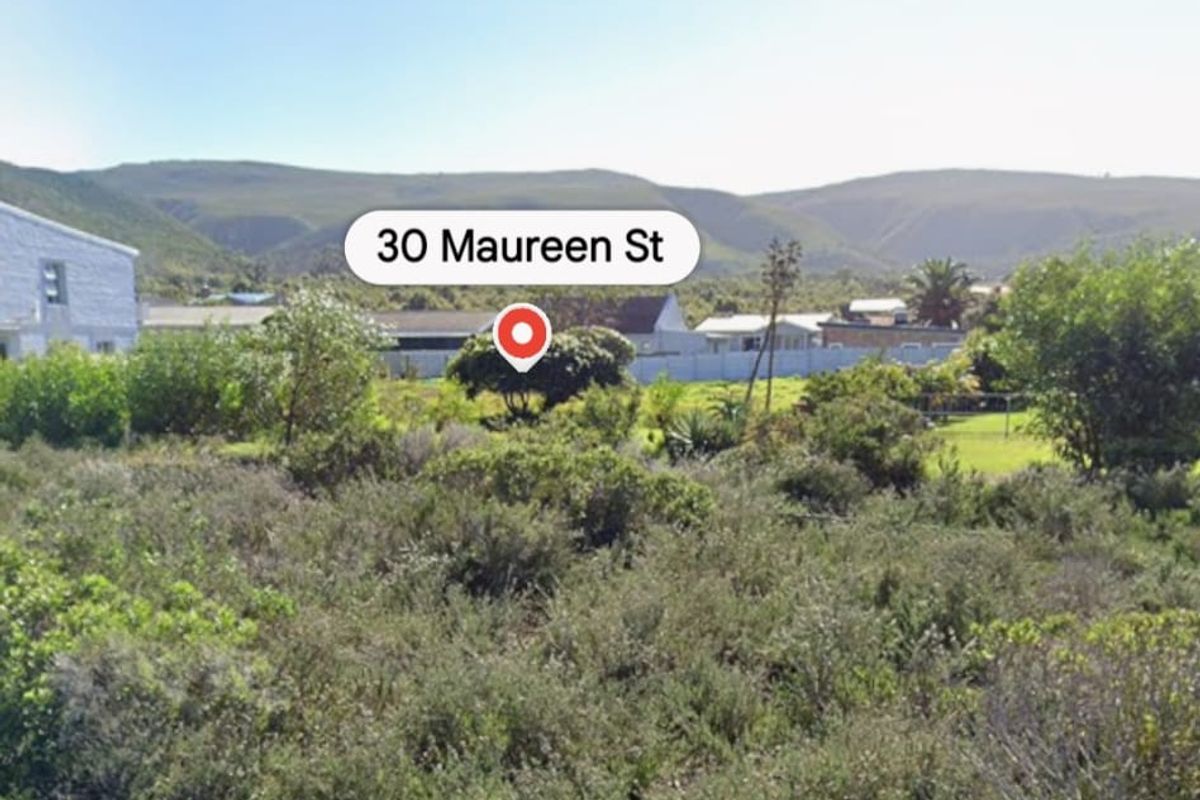 A view of a vacant residential plot featuring native vegetation with surrounding mountain views.