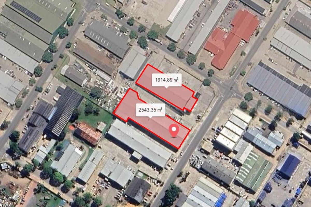 Aerial view of an industrial property complex featuring two warehouse buildings with designated site areas of 1914.89 square meters and 2543.35 square meters.