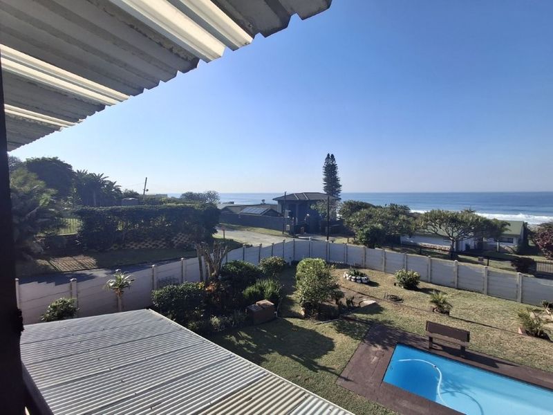 Unique Property Offering Two Homes Under One Roof, Magnificent Ocean Views And Perfectly Positioned On A Corner Stand, One Road From The Beach. An Exceptional Investment Opportunity!!!!!! At An Exceptional Price!!!! - Photo 6