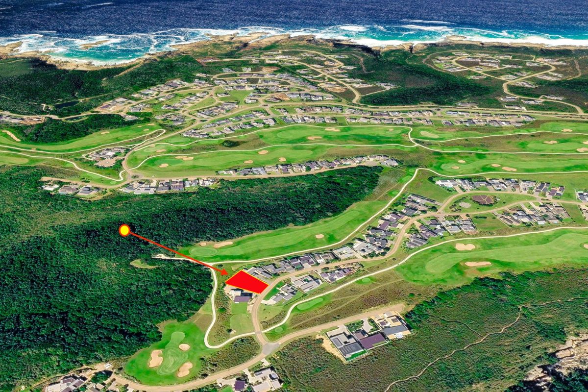 Aerial view of a residential plot located within a coastal golf estate, highlighting the surrounding landscape and proximity to the ocean.