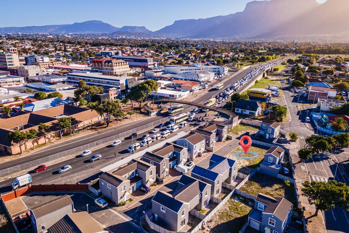 Aerial view of a residential development showing the property location, surrounding neighbourhood, and proximity to major transport routes and local amenities.