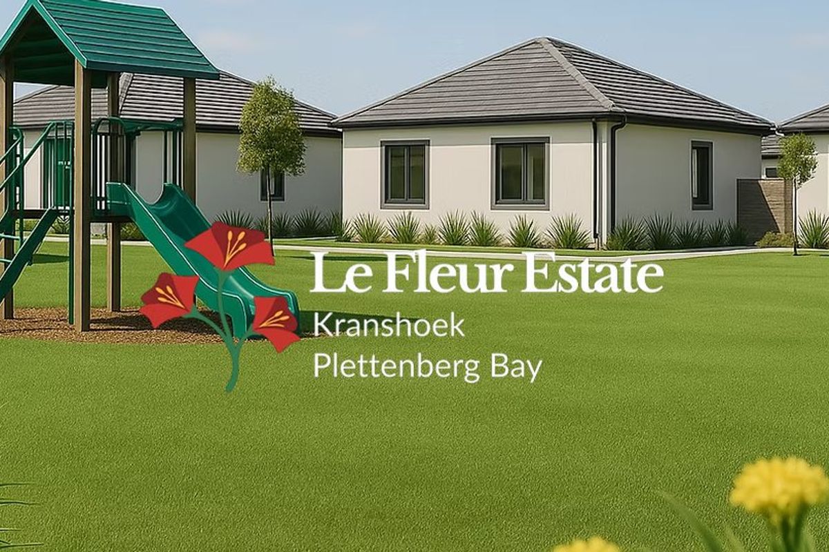 A view of the residential units at Le Fleur Estate in Plettenberg Bay, featuring well-maintained lawns and modern architectural design.