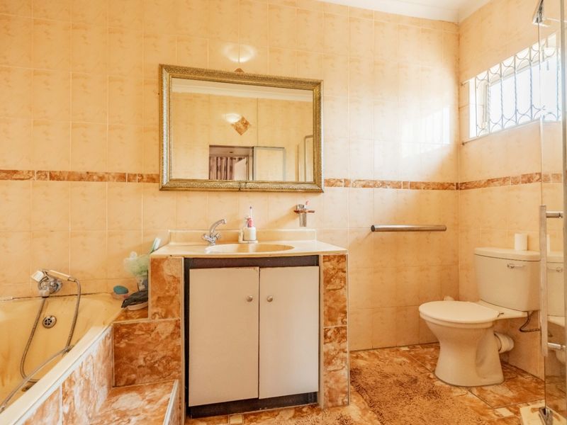 Spacious 7-Bedroom Home with Multiple Living Options in Reservoir Hills - Photo 6