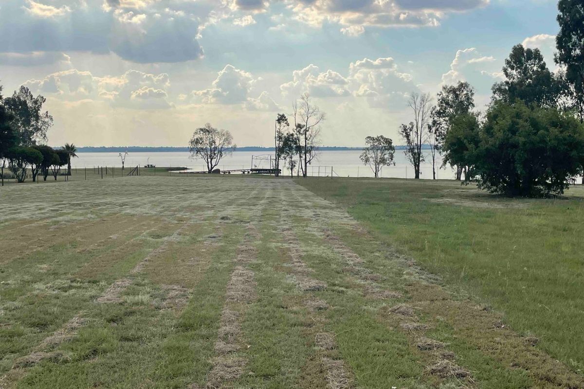 Expansive vacant residential land offering direct waterfront views and a peaceful natural setting.