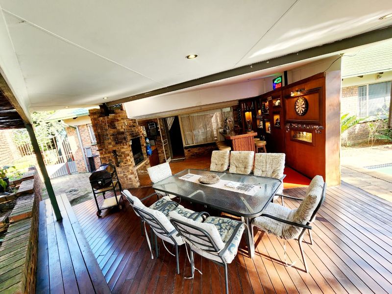Spacious Rooihuiskraal home with pool and braai - Photo 5