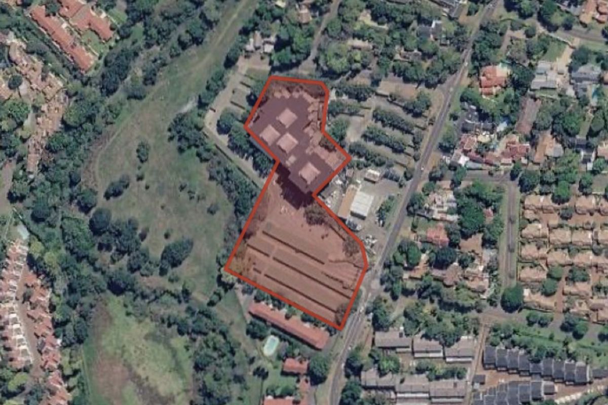 An aerial satellite view showing the property site boundary in relation to the surrounding residential neighborhood and local infrastructure.