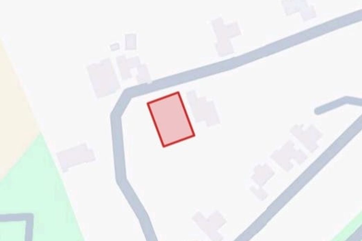 A map-based aerial view highlighting the location and boundaries of the vacant residential land plot.