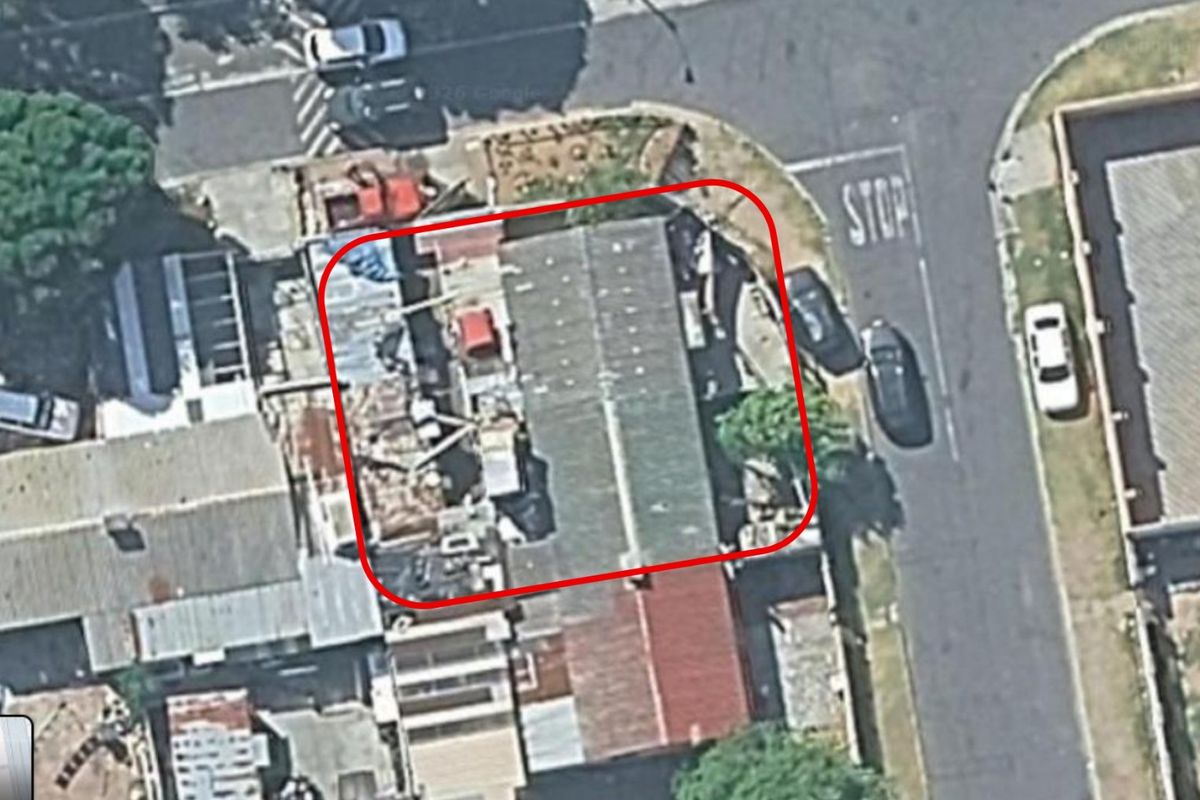 Aerial view of the property showing the roof structure and surrounding street layout.