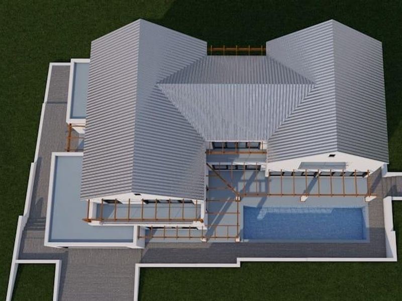 Aerial view of a residential property featuring a metal roof, swimming pool, and pergola-covered patio area.