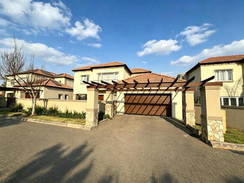 Front elevation of a modern residential property featuring a paved driveway, timber pergola, stone-clad pillars, and a tiled roof with an integrated garage.