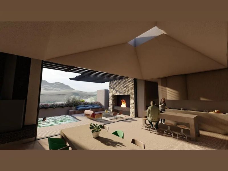 A modern open-plan living and kitchen area featuring a built-in fireplace, skylight, and seamless transition to an outdoor patio with a swimming pool.