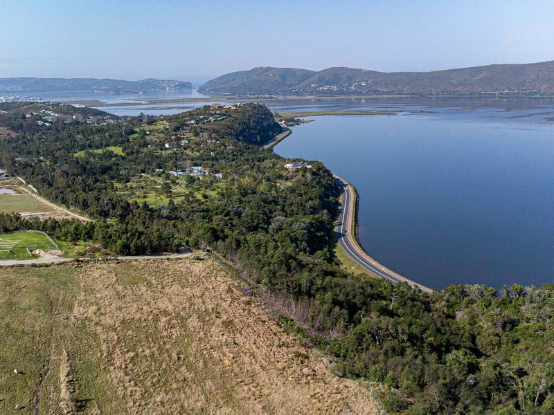 An aerial view of the vacant land parcel showcasing its proximity to the estuary and surrounding natural landscape.