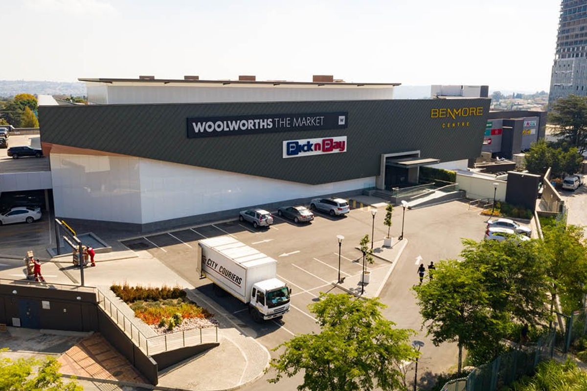 Aerial view of the Benmore Centre commercial property, featuring a large retail facade, dedicated parking area, and landscaped surroundings.