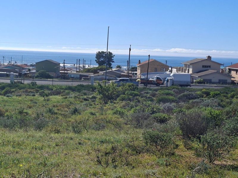 A view of the vacant residential land looking towards the coastal neighbourhood and ocean horizon.