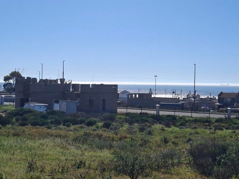 A view of the coastal landscape and surrounding neighborhood from the vacant residential land.