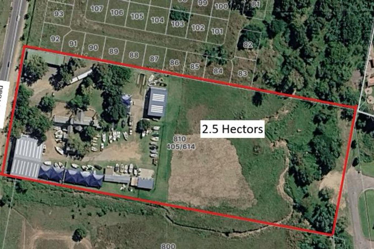 Aerial view of a 2.5-hectare commercial property featuring multiple structures, paved areas, and significant undeveloped land, with direct access from Lever Road.