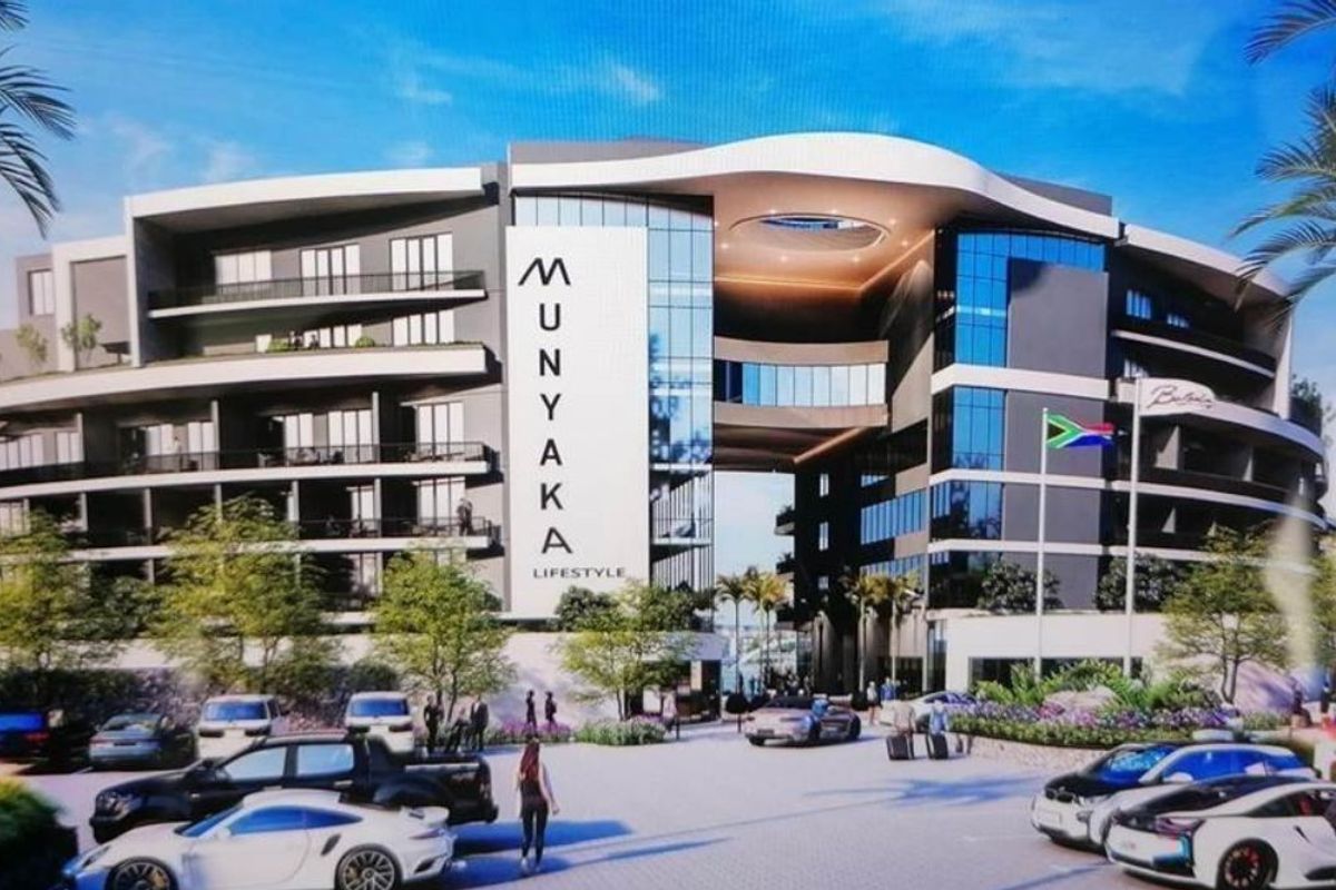 A modern architectural rendering of the Munyaka Lifestyle apartment complex, featuring contemporary facade design, glass balconies, and a prominent entrance structure.