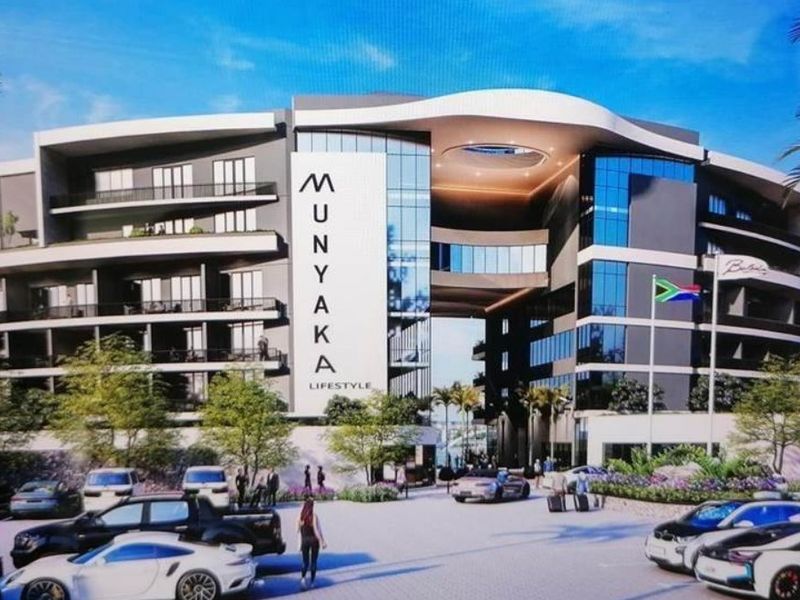 A modern architectural rendering of the Munyaka Lifestyle apartment complex, featuring contemporary facade design, glass balconies, and a prominent entrance structure.