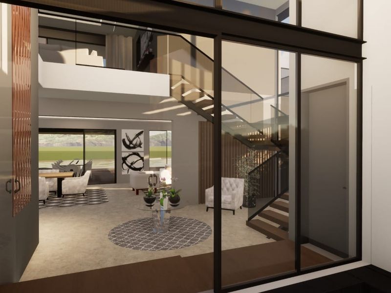 A modern, open-plan living area featuring a striking staircase with glass balustrades, high ceilings, and expansive windows that provide abundant natural light.