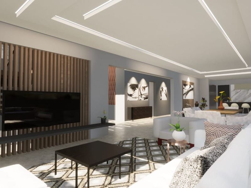 Spacious open-plan living area featuring a modern slatted timber feature wall, recessed linear ceiling lighting, and a sleek kitchen with marble-look finishes.