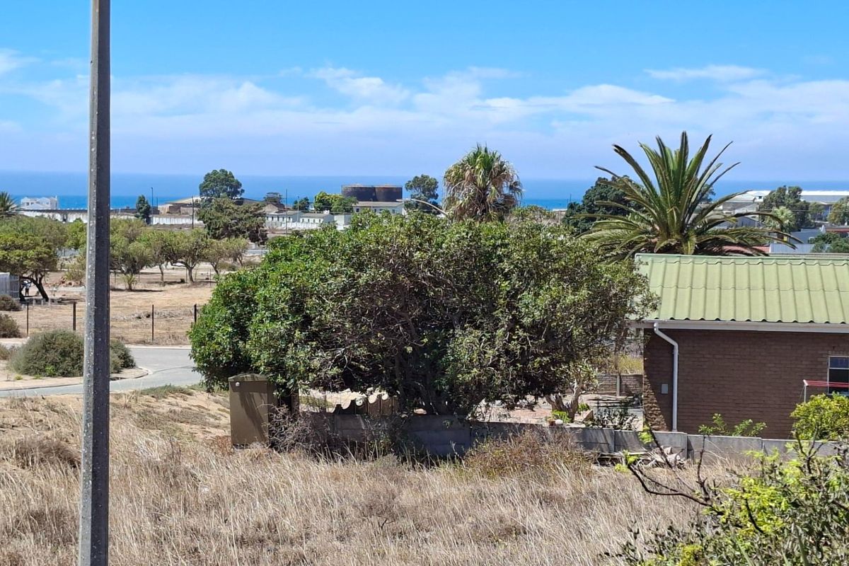 A scenic elevated view overlooking the surrounding residential landscape with a distant ocean horizon.