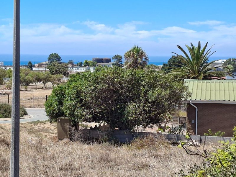 A scenic elevated view overlooking the surrounding residential landscape with a distant ocean horizon.