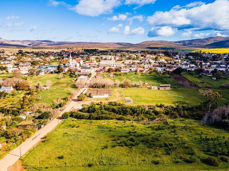 An aerial view of the residential land parcel showing its location within the surrounding town and landscape.