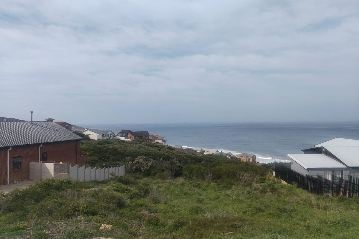 A scenic view overlooking the coastal landscape and ocean from the vacant residential property.