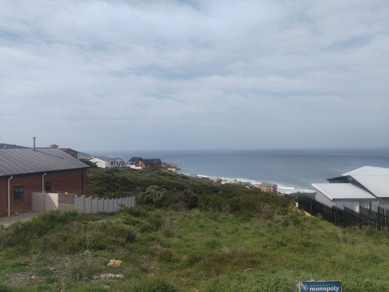 A scenic view overlooking the coastal landscape and ocean from the vacant residential property.