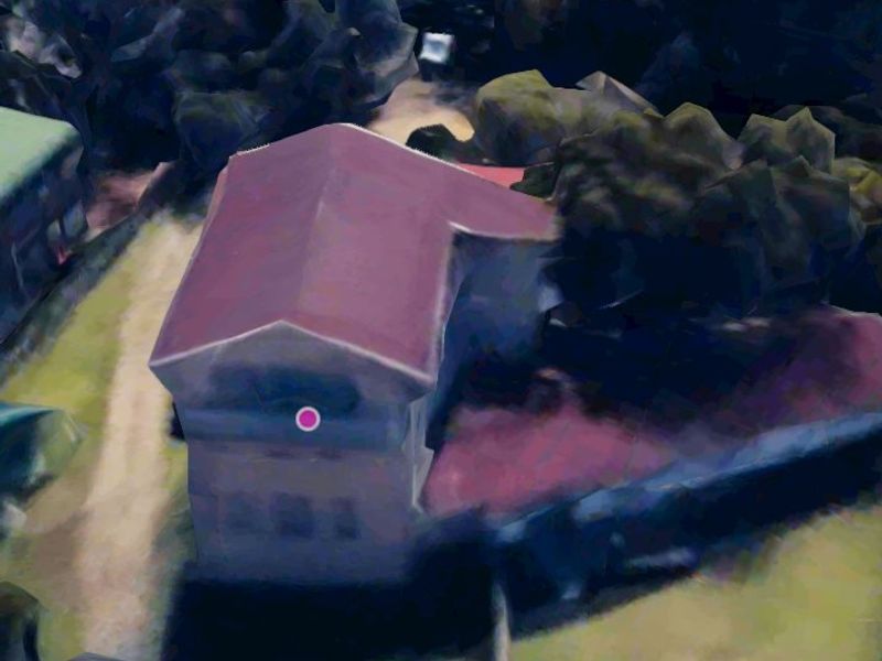 An aerial view of the property showing the building structure and surrounding grounds.
