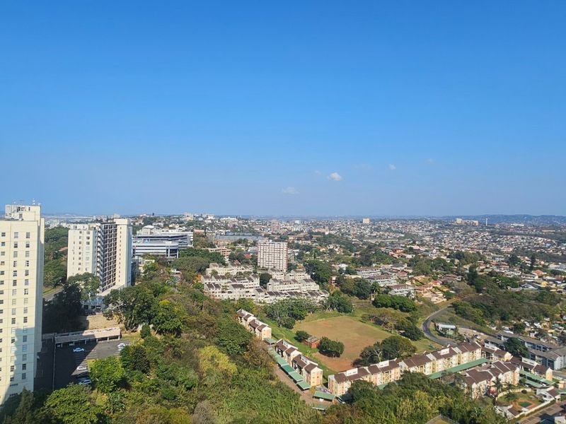 An elevated panoramic view overlooking the surrounding urban landscape and residential neighborhood.