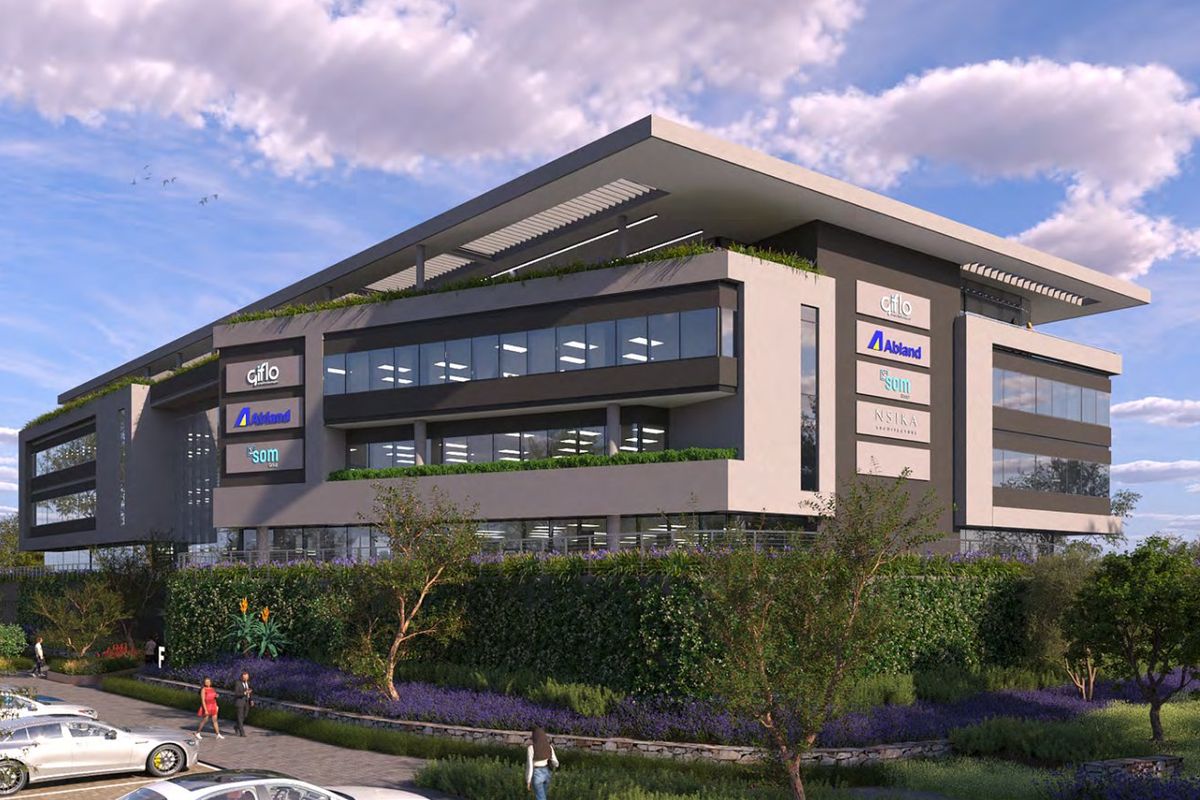 Modern multi-story commercial office building featuring contemporary architectural design, glass facade, and landscaped surroundings with dedicated parking.