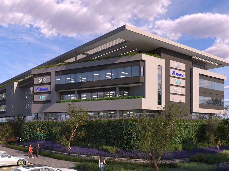 Modern multi-story commercial office building featuring contemporary architectural design, glass facade, and landscaped surroundings with dedicated parking.
