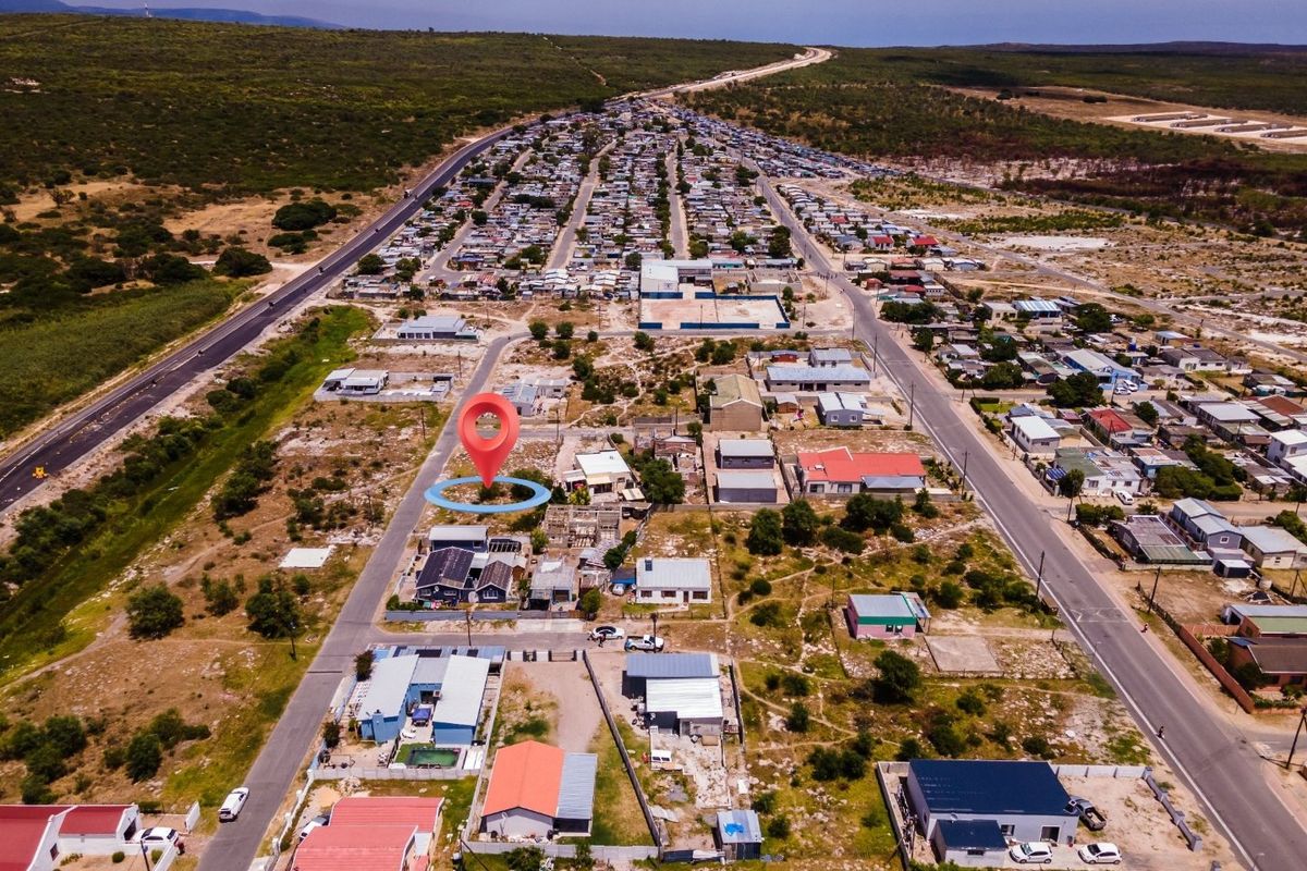 Aerial view of a residential plot located within an established neighborhood, showing surrounding street layout and local infrastructure.