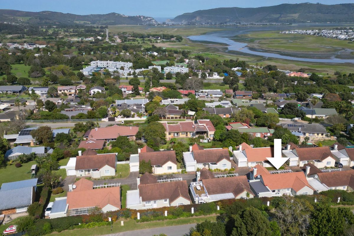 Aerial view of a residential property within a suburban estate, showcasing the roof structure and surrounding neighbourhood landscape.