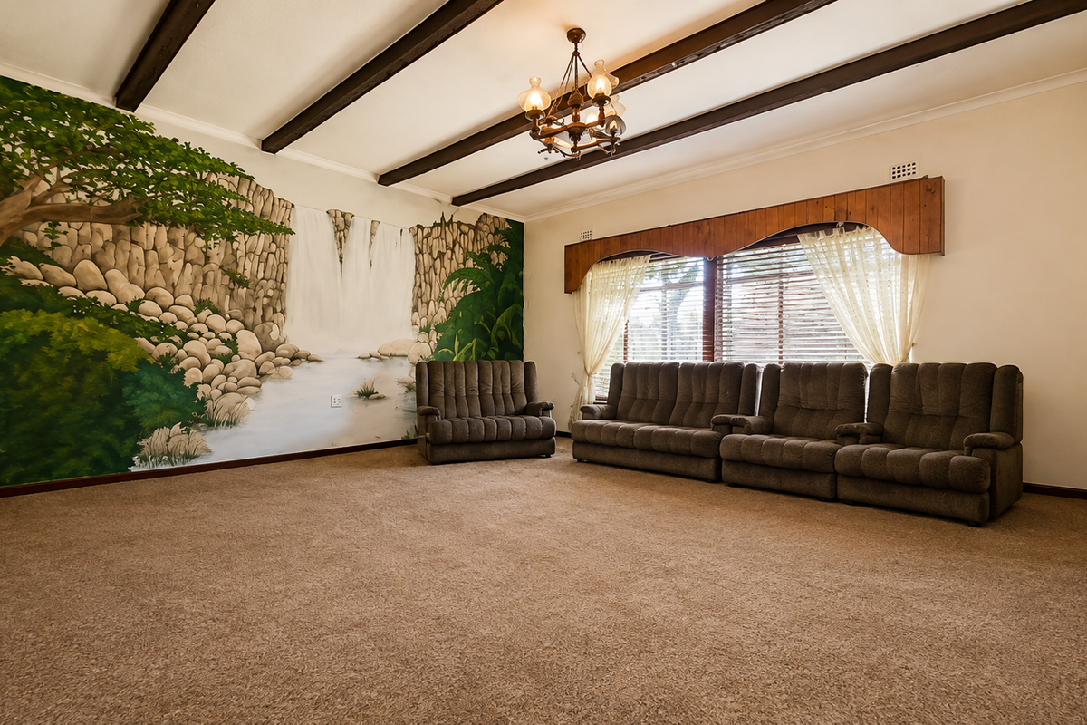 Spacious living room featuring exposed timber ceiling beams, a decorative chandelier, and a large wall mural, offering a dated but well-maintained interior space.