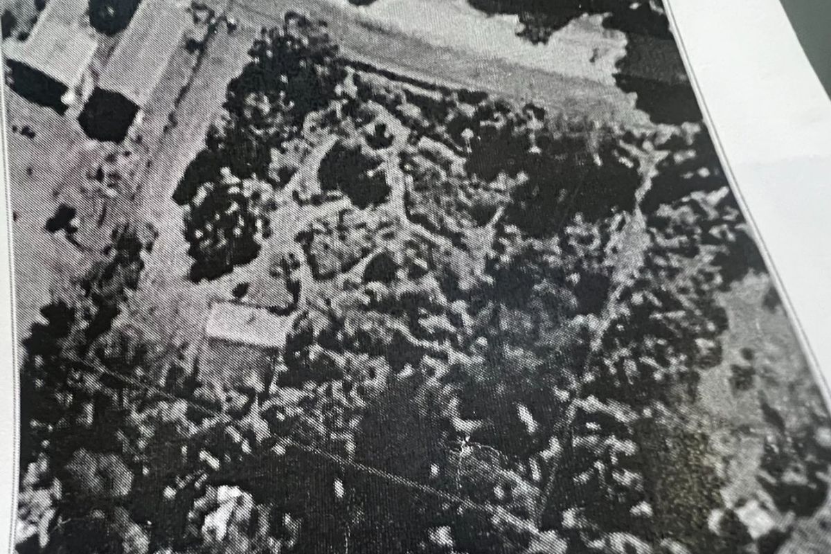 An aerial satellite view of the property grounds and surrounding landscape.