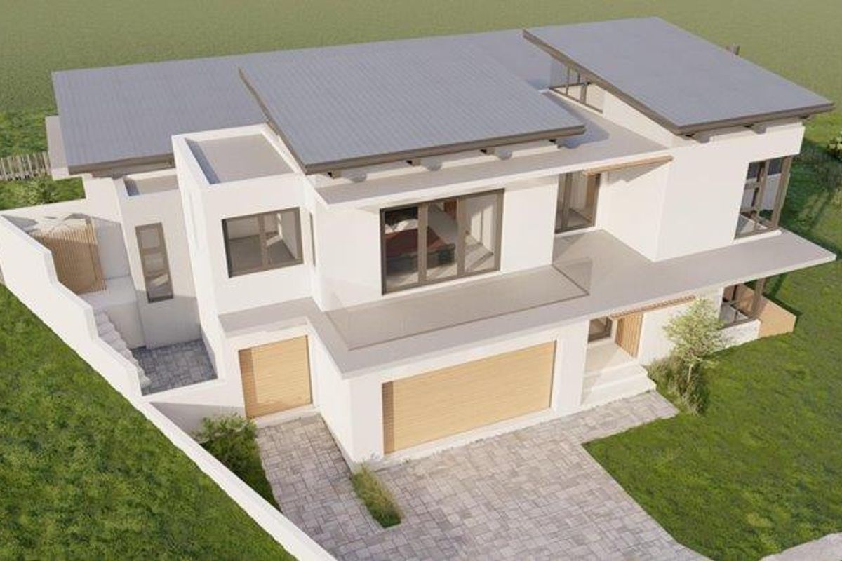 An aerial perspective of a modern residential property featuring a contemporary architectural design, paved driveway, and integrated garage.