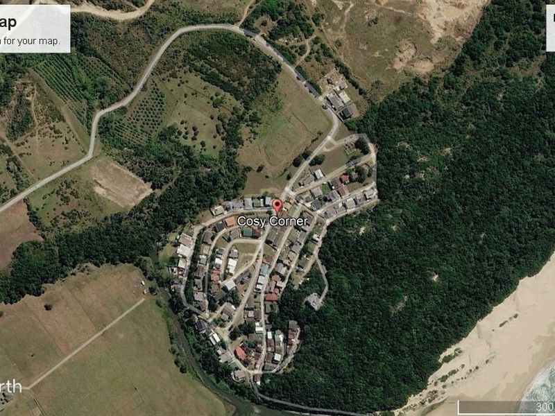 An aerial satellite view showing the residential area and surrounding landscape context of the property.